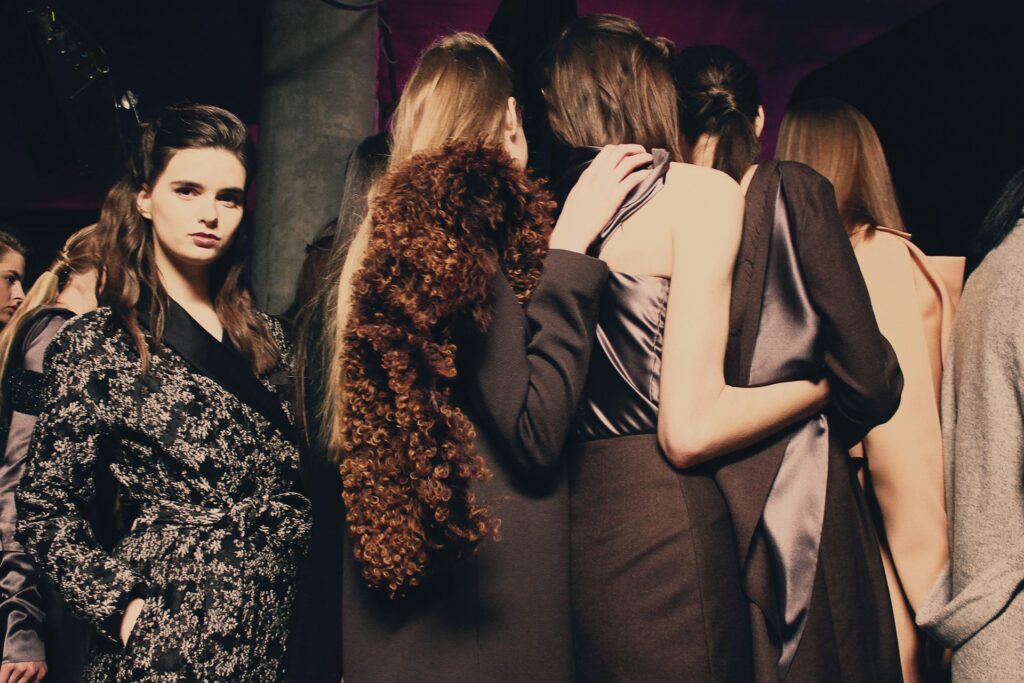 Models walk the runway showcasing unique vintage clothing